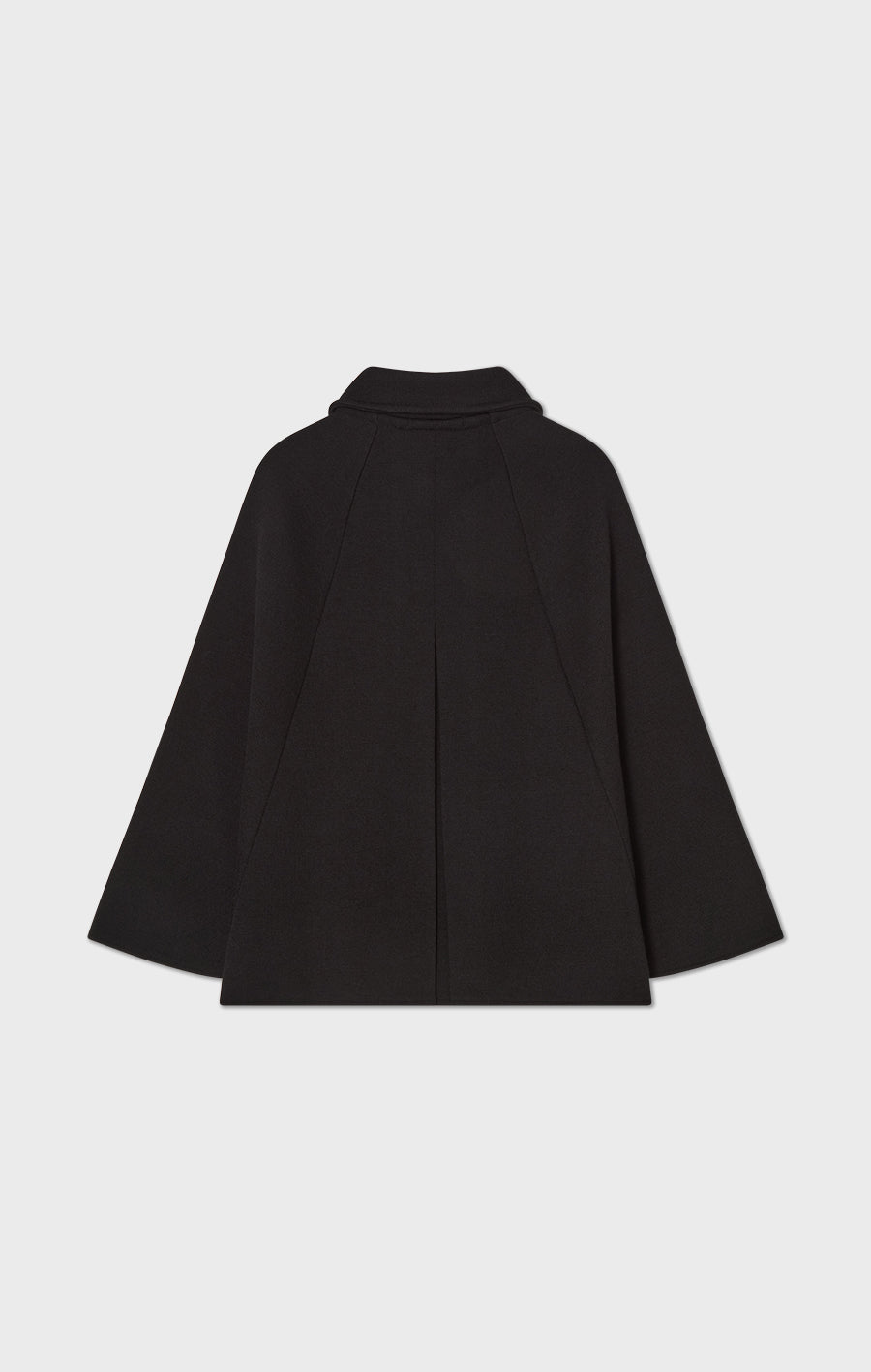 Isa stickad cape i ull svart